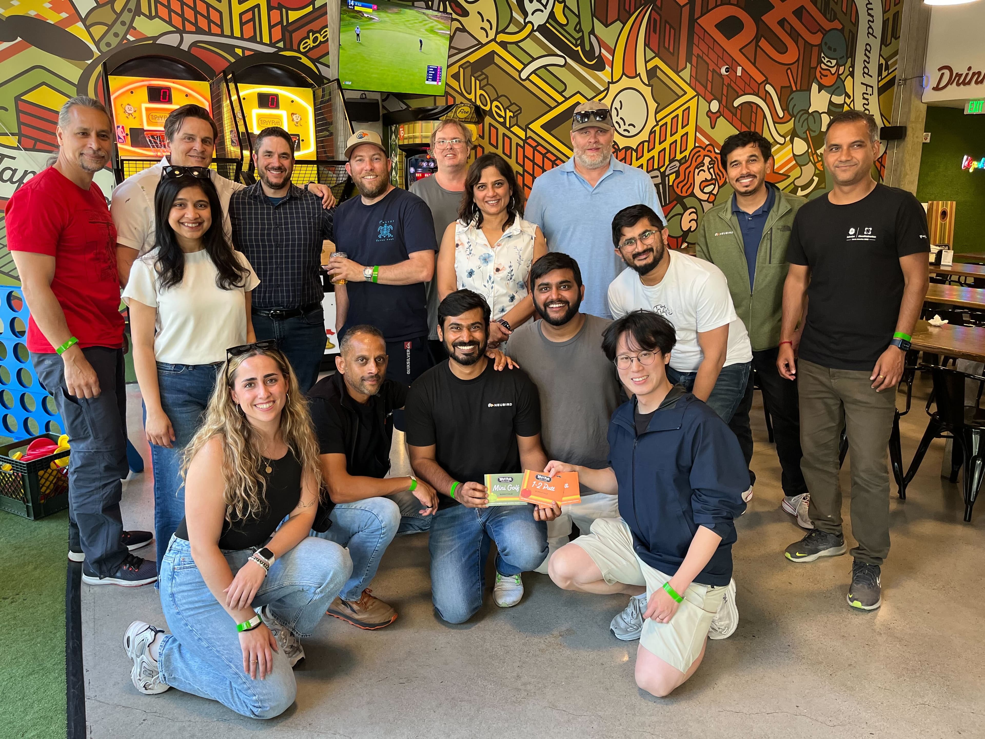 NeuBird AI team at the arcade